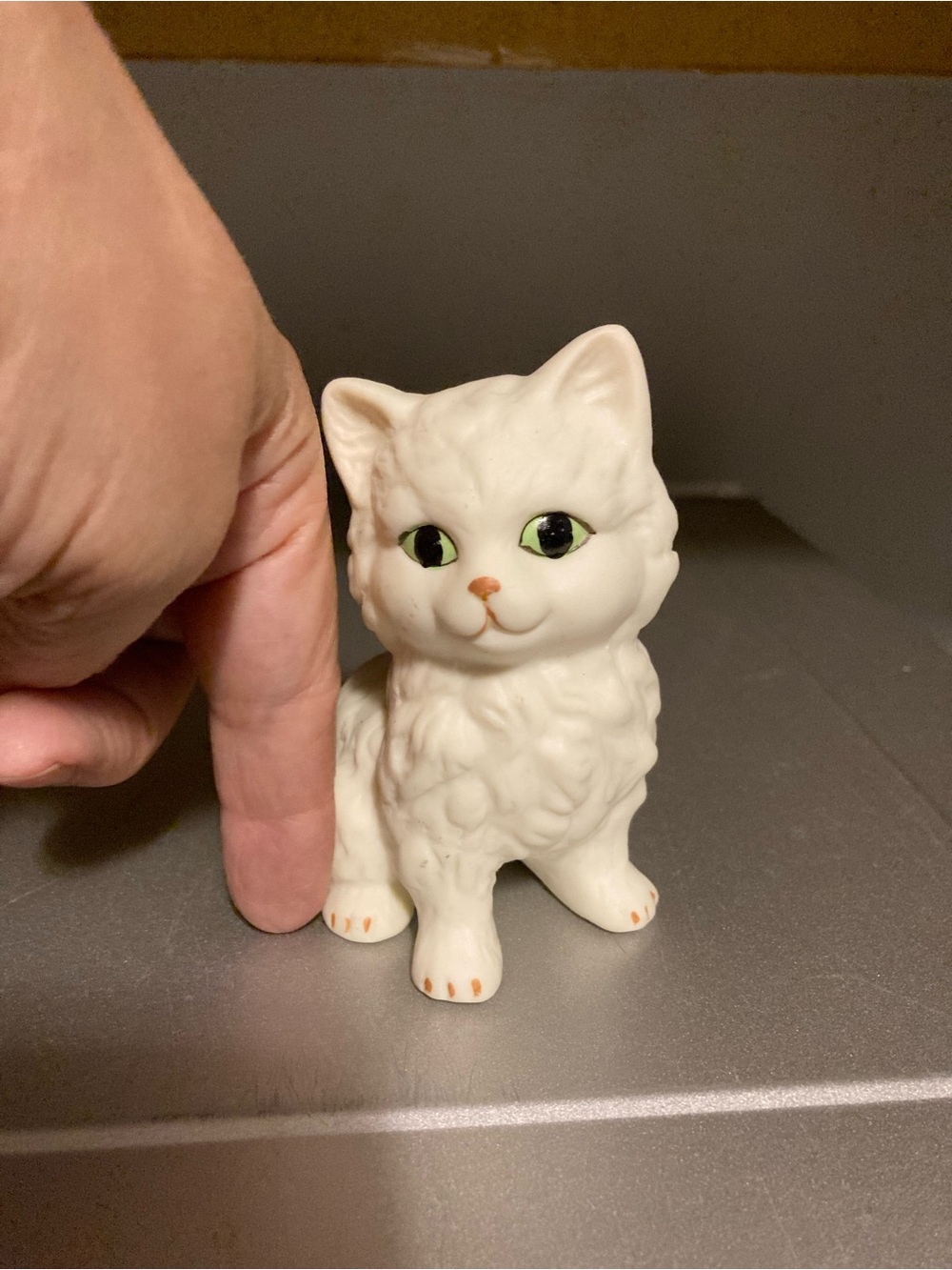 White Ceramic Cat Figurine with Green Eyes